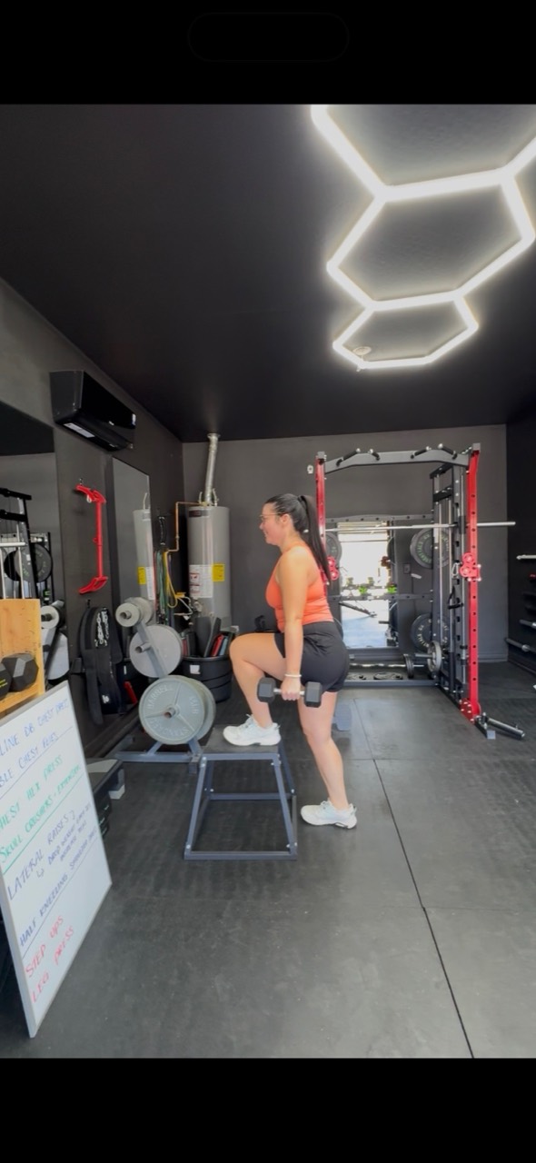 A Desert Blaze member doing a weighted step-up in the studio